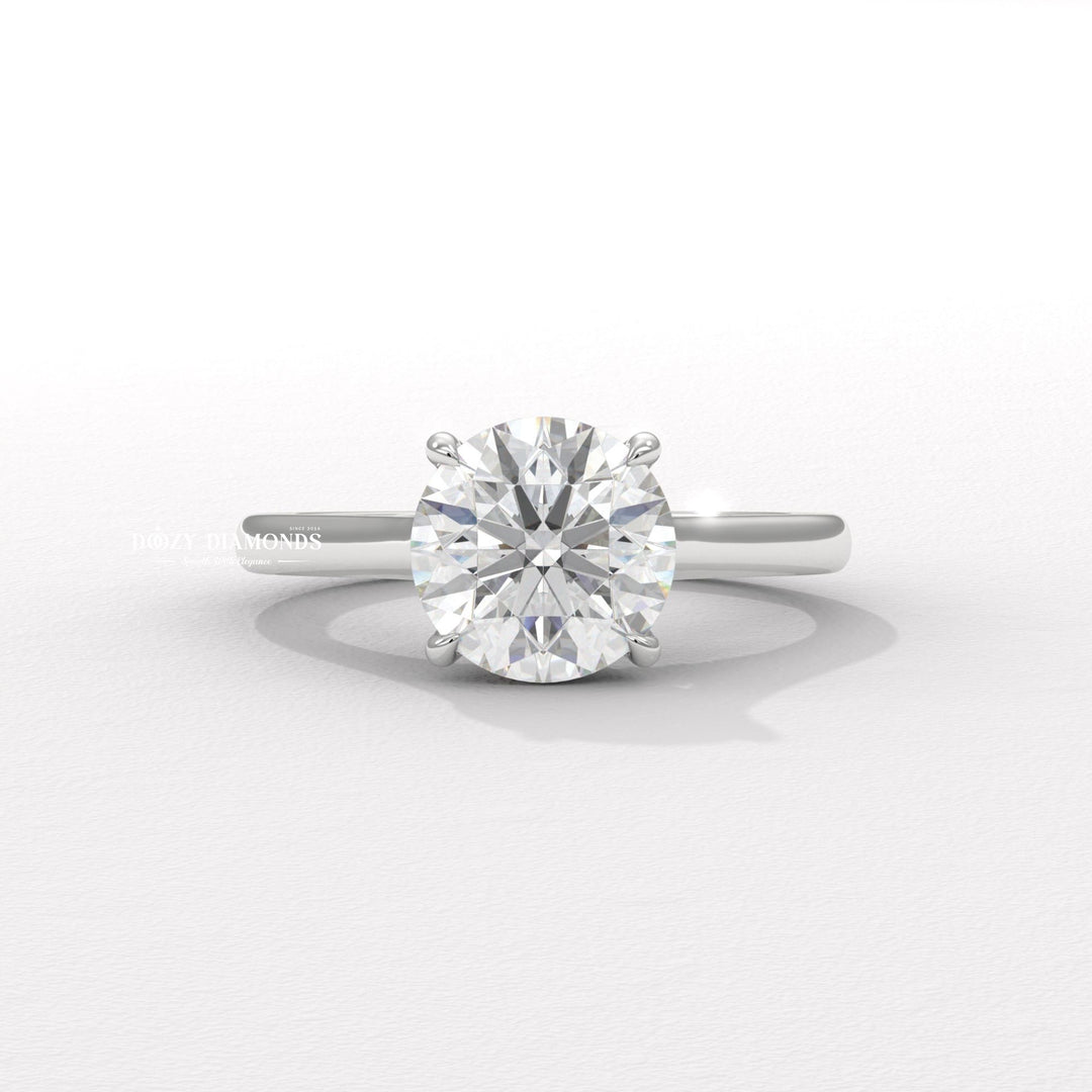Round cut diamond ring worn on hand