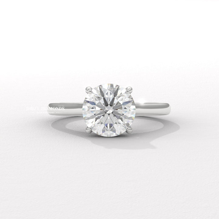 Round cut diamond ring worn on hand