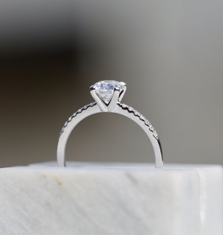 Round solitaire lab grown diamond ring side profile in gold setting