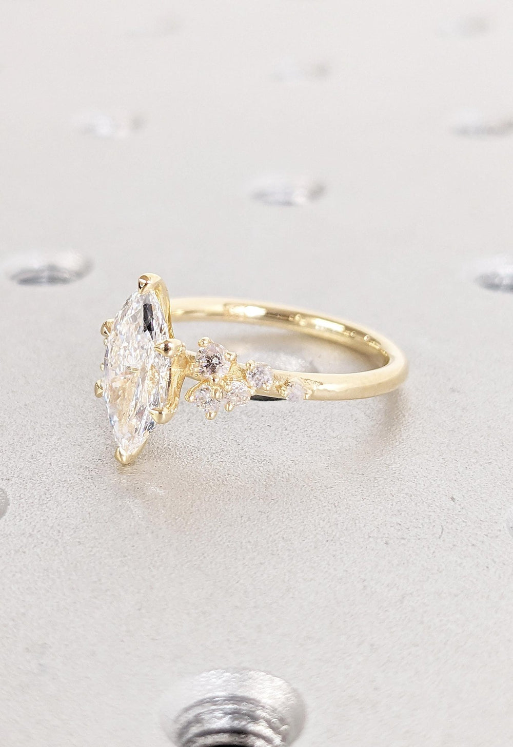 Marquise cluster engagement ring close-up highlighting diamond sparkle