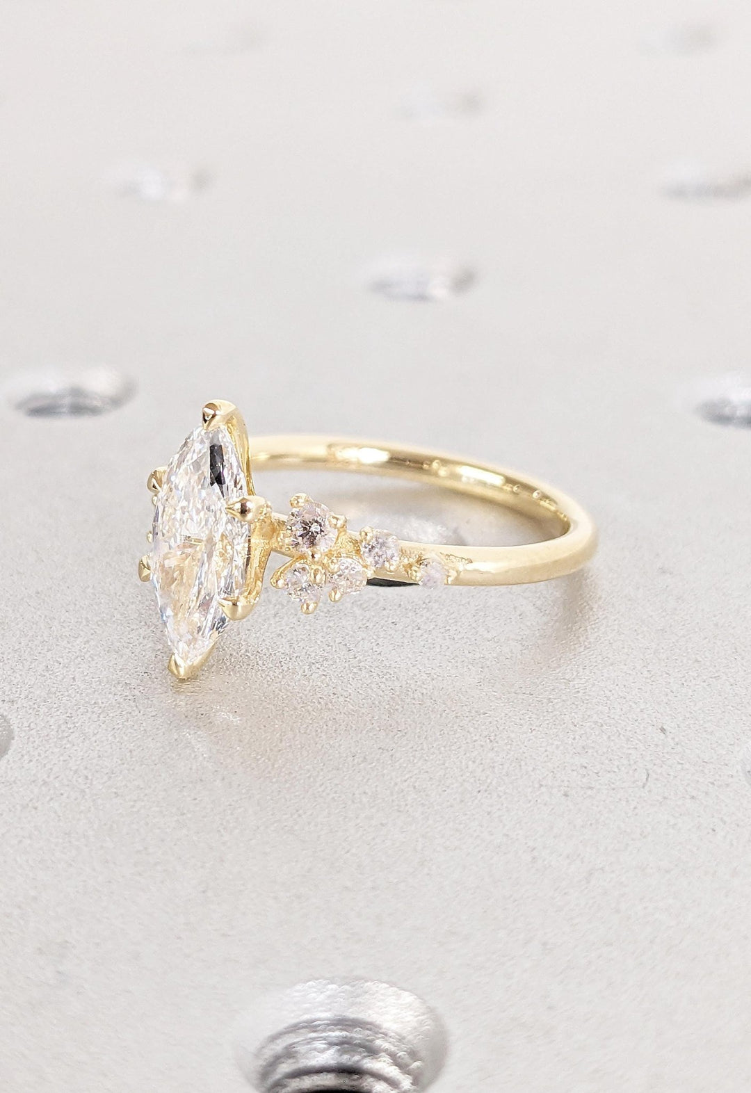 Marquise cluster engagement ring close-up highlighting diamond sparkle