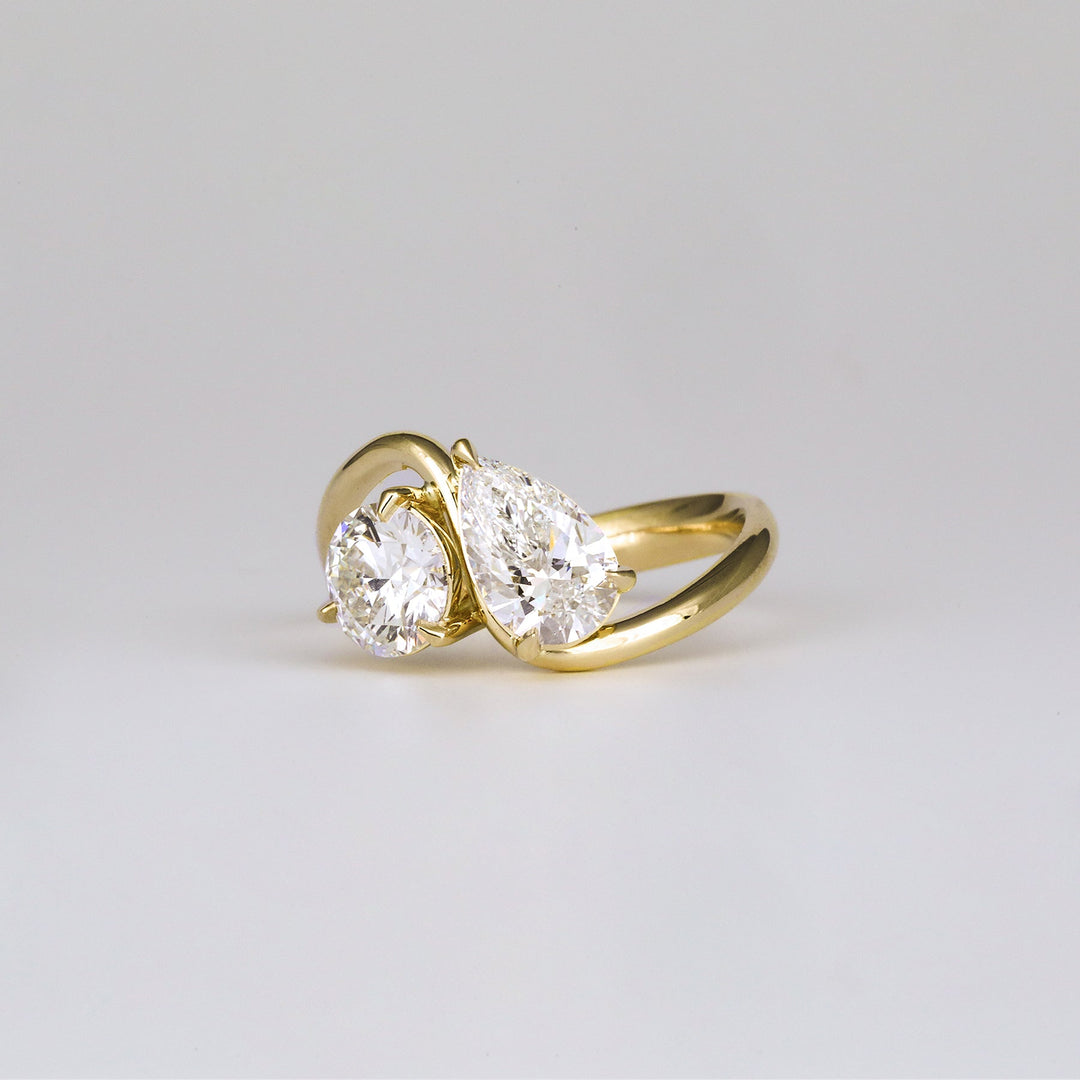 Lifestyle shot of round solitaire diamond ring on hand