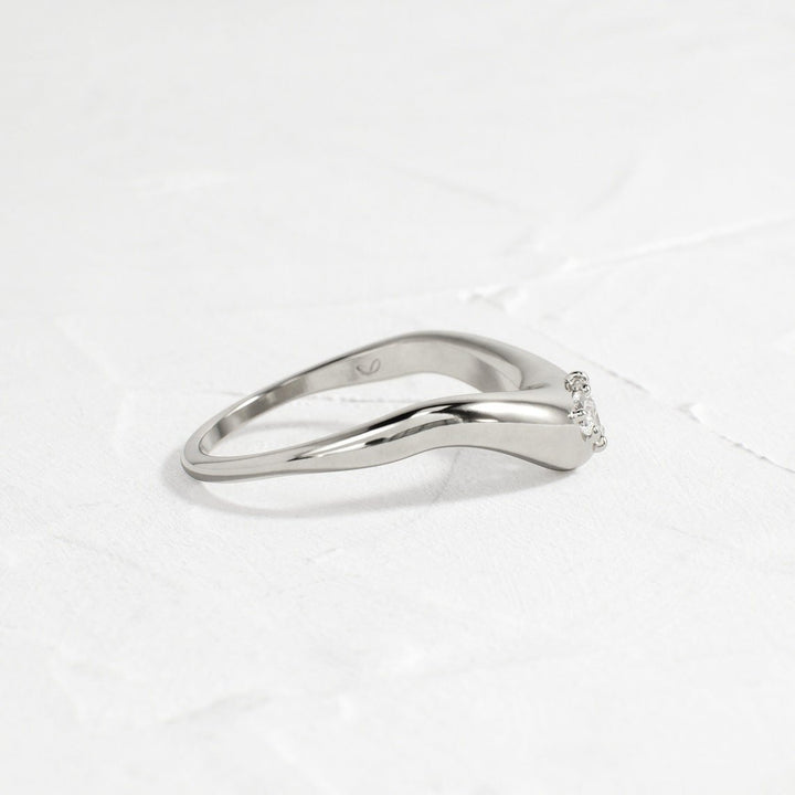 Side view of pear diamond wedding band