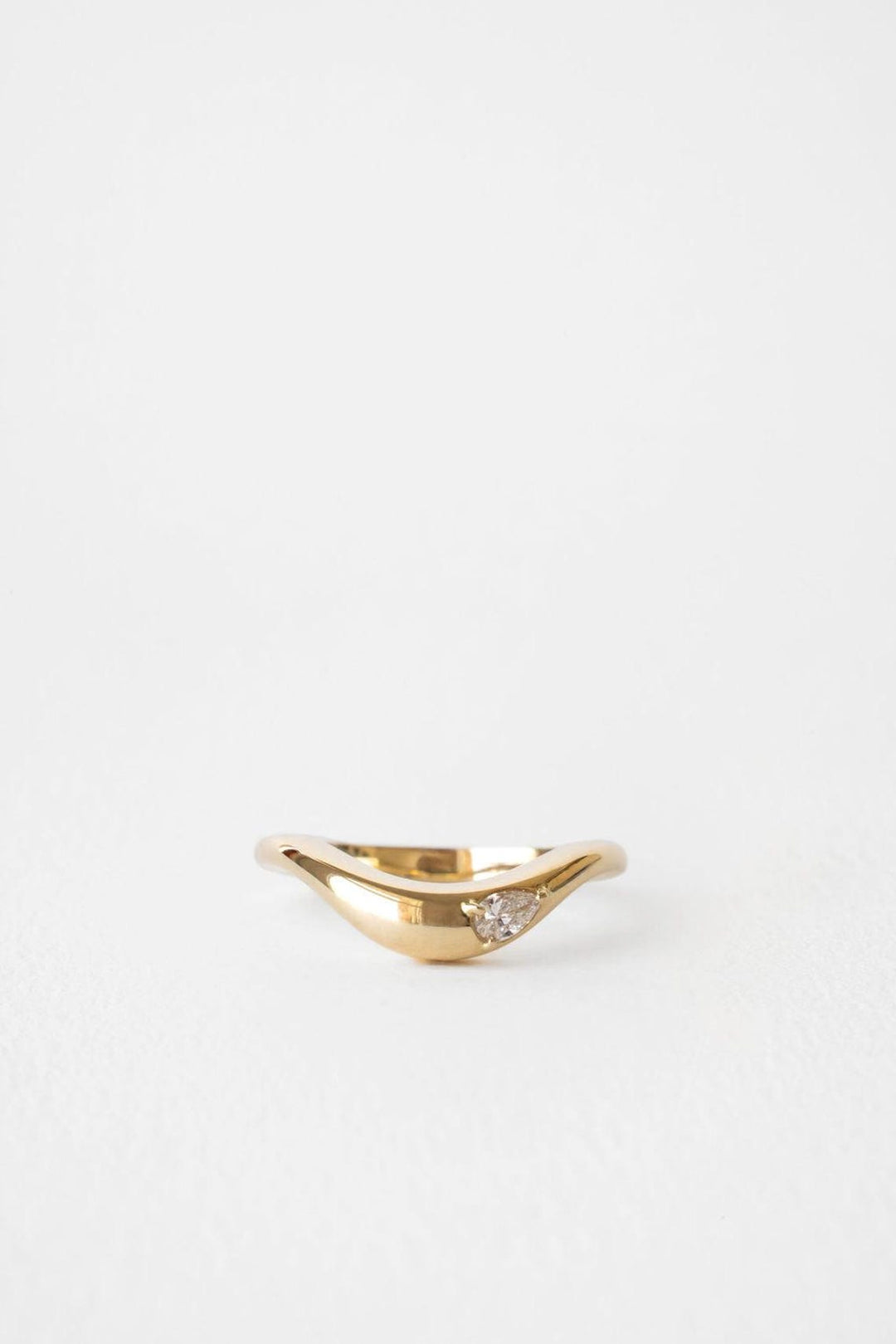 Pear diamond wedding band in yellow gold