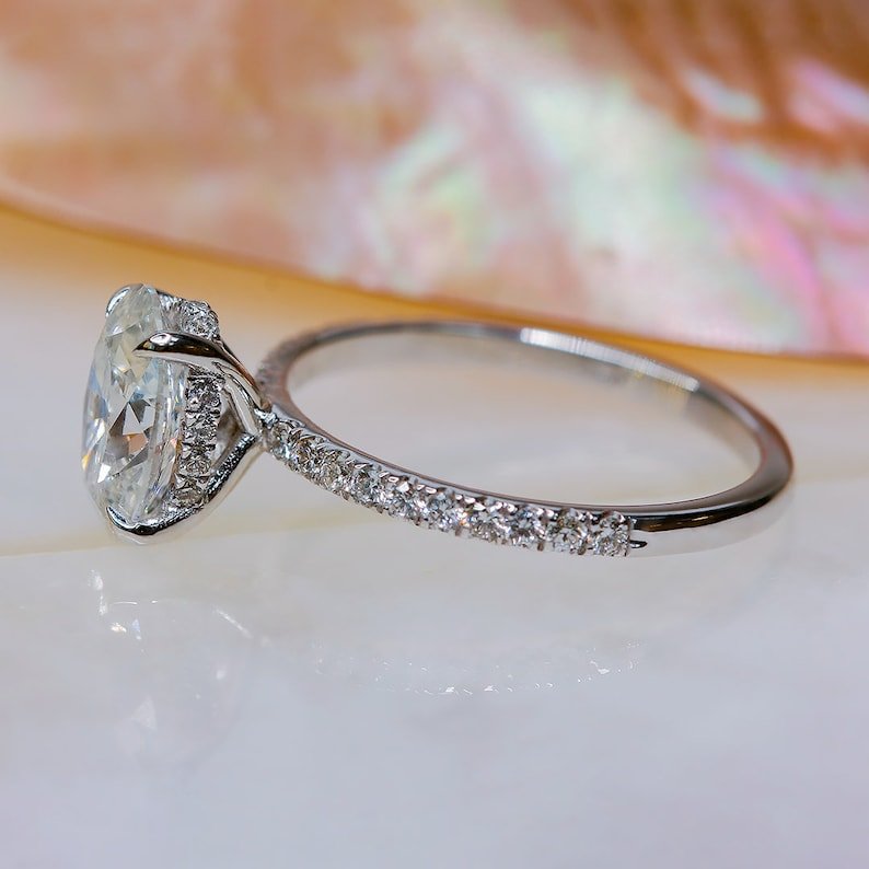 Oval hidden halo engagement ring with certified lab grown diamond