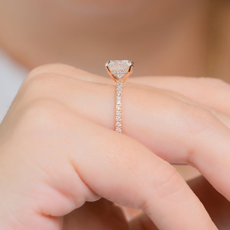 Certified cushion cut diamond featured in solitaire engagement ring