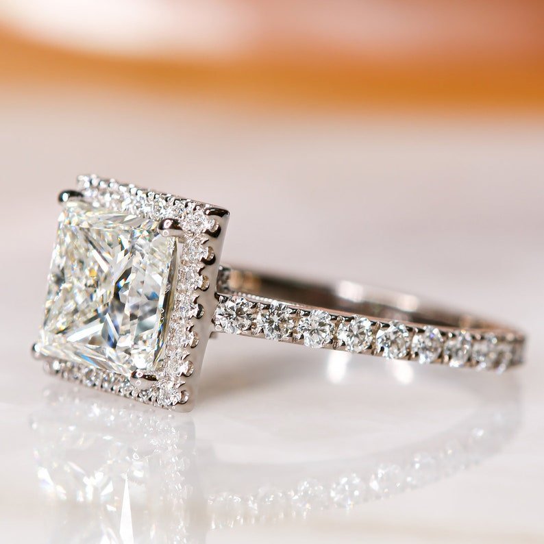 Princess halo engagement ring with IGI certificate and packaging
