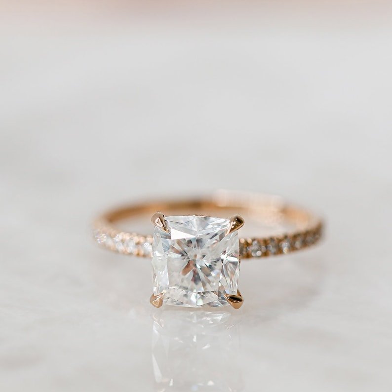 Cushion solitaire ring set with an IGI graded diamond