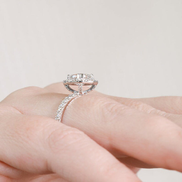Side angle of cushion halo diamond engagement ring