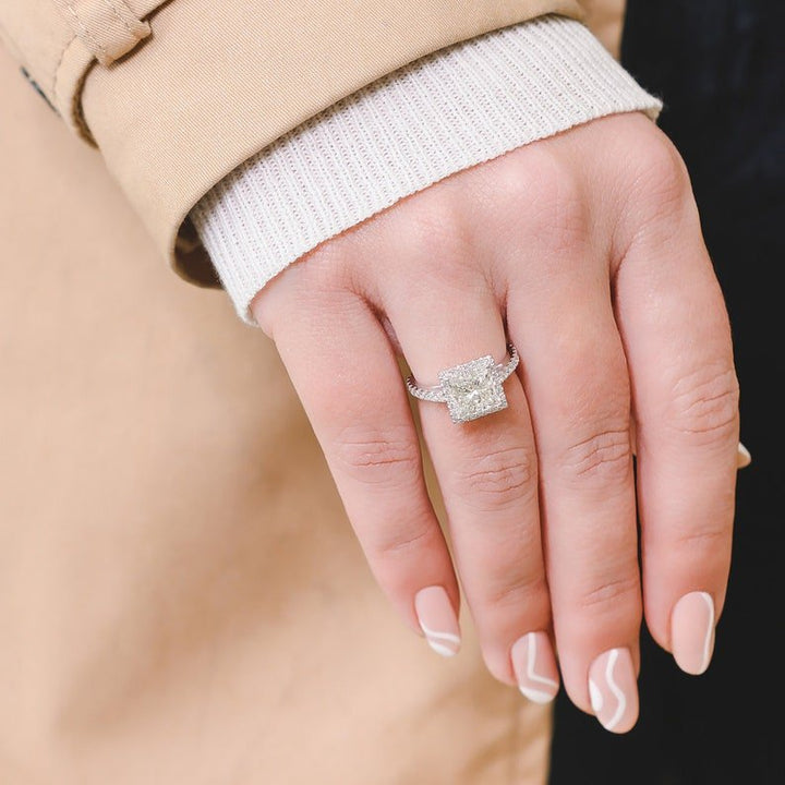 Princess halo diamond ring presented in signature gift packaging