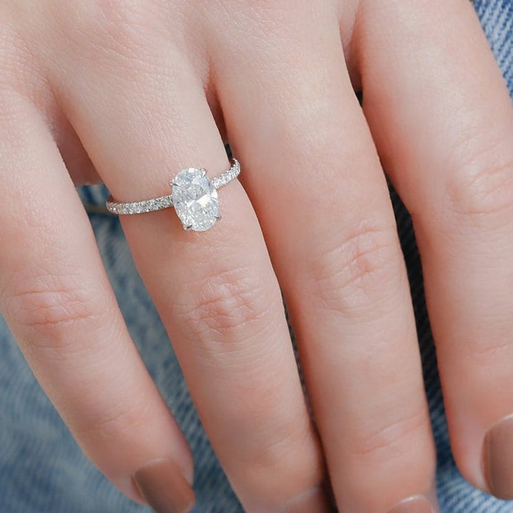 Oval hidden halo diamond engagement ring available in multiple metals