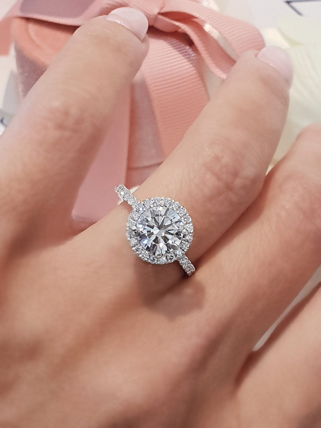 Angled view of round cut diamond in halo setting