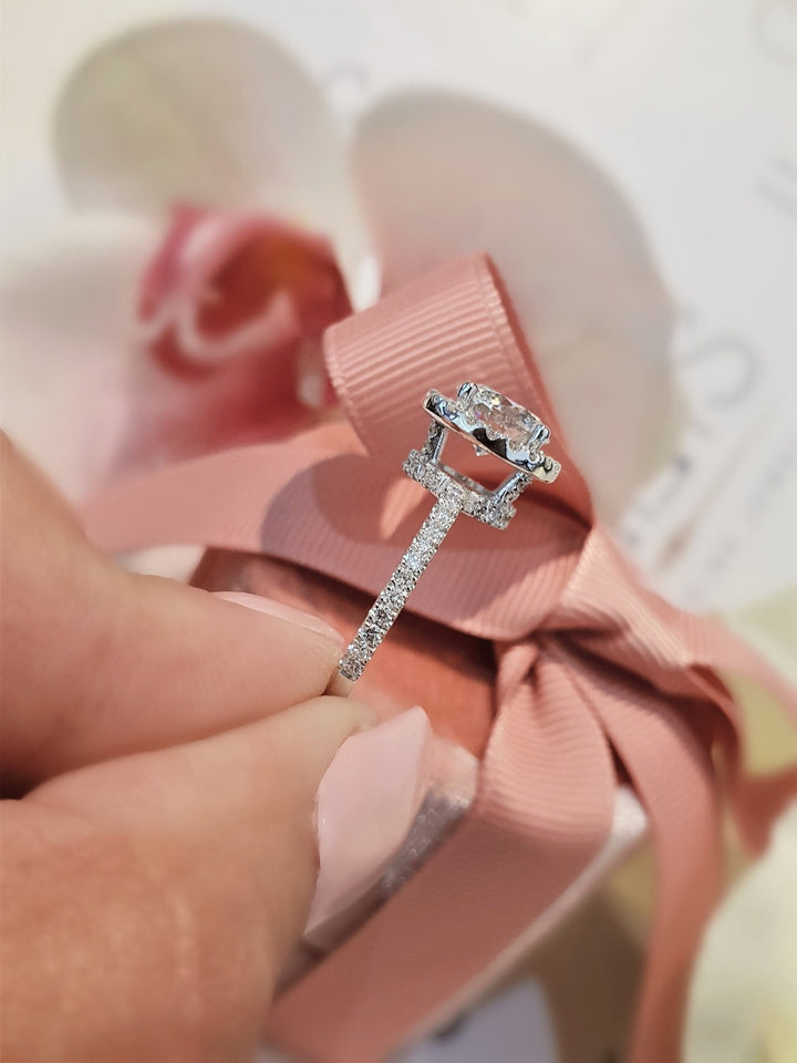 Round halo engagement ring close-up highlighting diamond sparkle