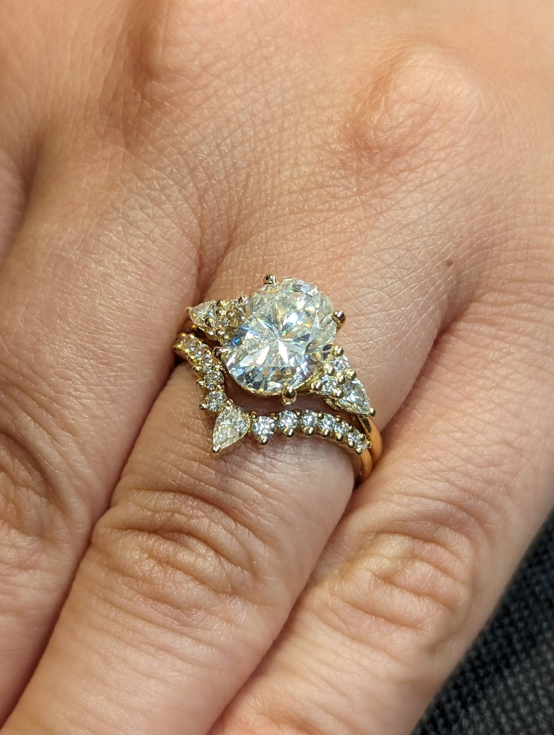 Oval cluster lab grown diamond ring fitted on finger