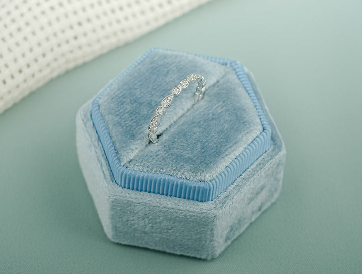 Round diamond band stacked with engagement ring