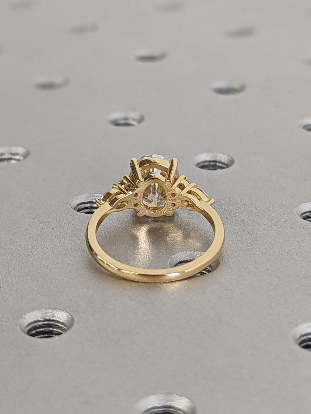 Oval cut engagement ring side view showing band detail
