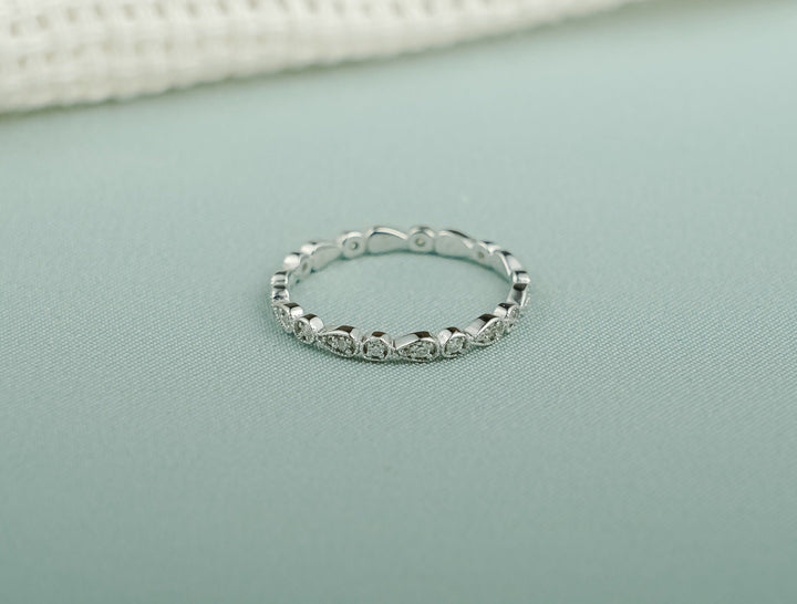Round diamond wedding band in rose gold