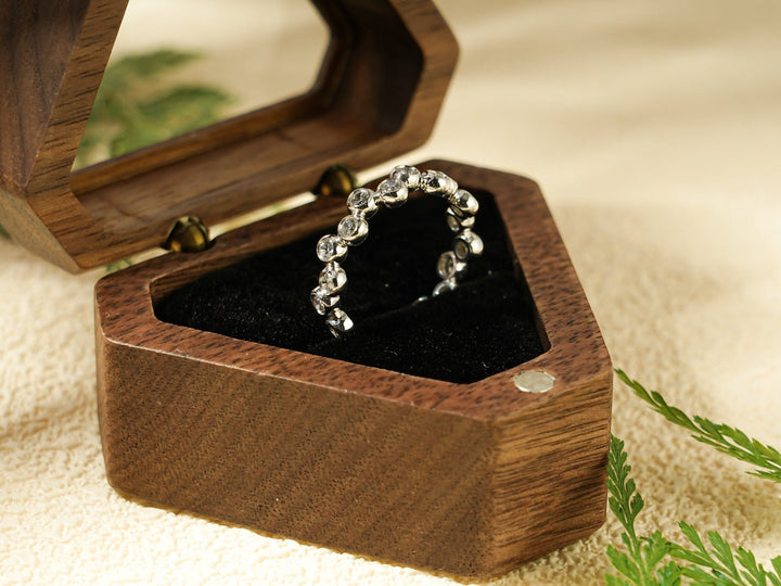 Round diamond wedding band in rose gold