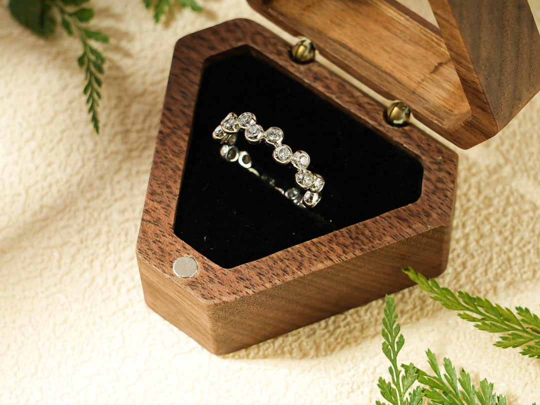 Side view of round diamond wedding band