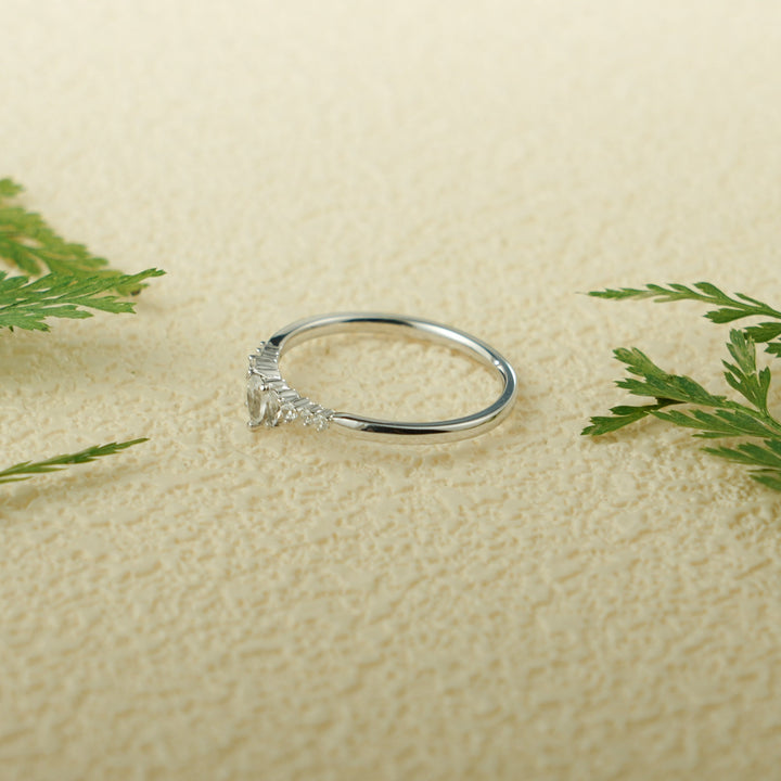 Side view of pear & round diamond wedding band