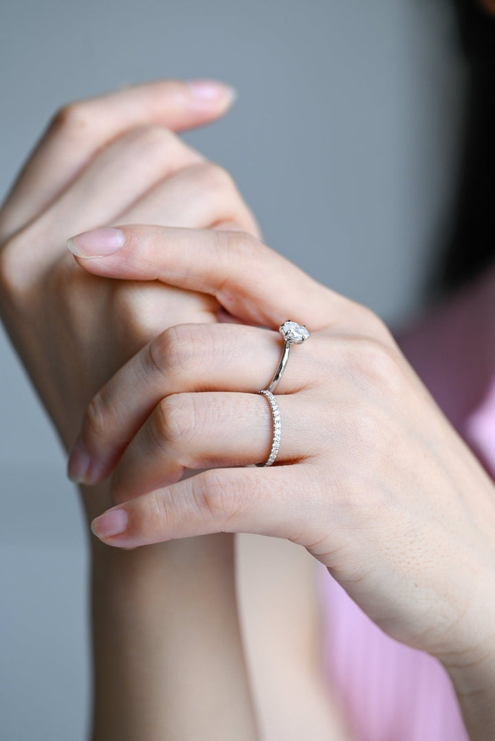 Round diamond band stacked with engagement ring
