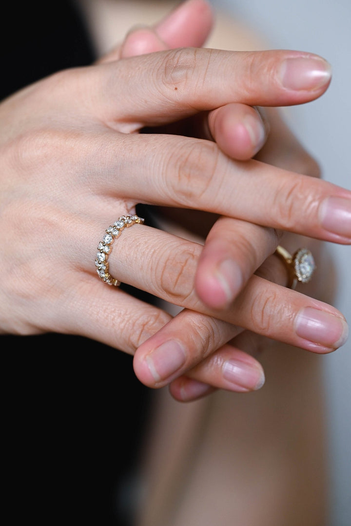 Round diamond band stacked with engagement ring