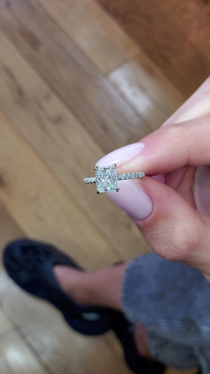 Radiant hidden halo engagement ring close-up highlighting diamond sparkle