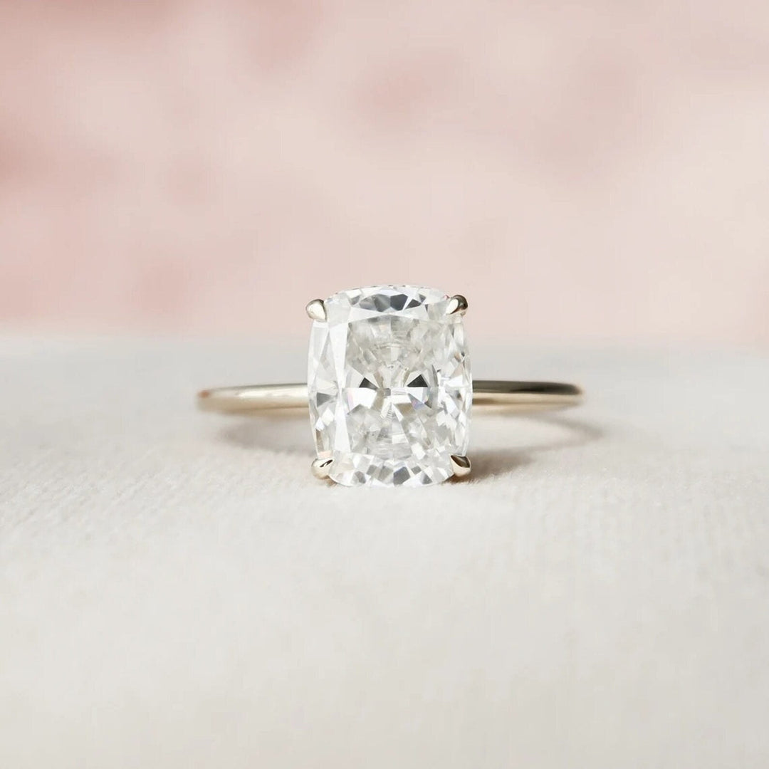 Cushion hidden halo engagement ring viewed from the side