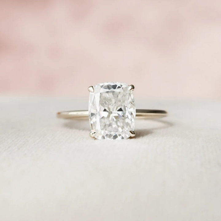 Cushion hidden halo engagement ring viewed from the side