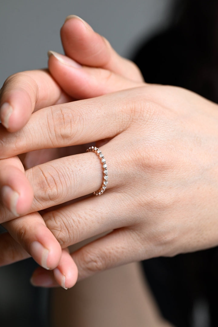Side view of round diamond wedding band