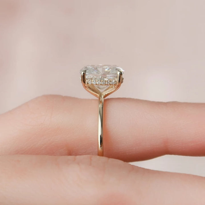 Cushion cut diamond ring worn on hand