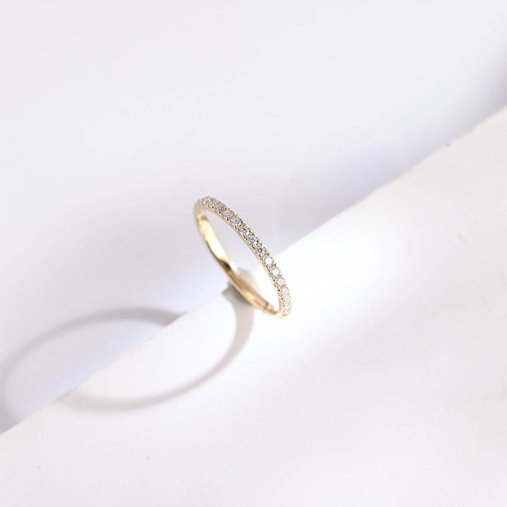 Round lab grown diamond band worn on hand