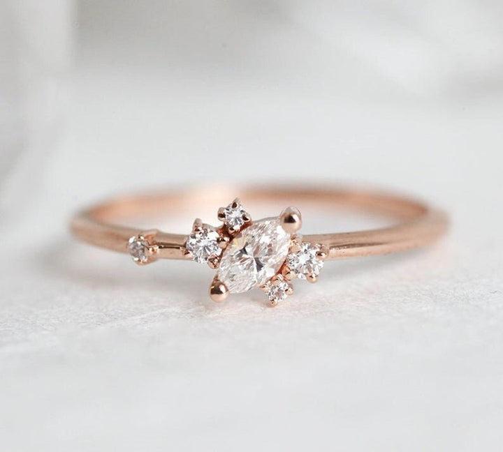 Marquise cut diamond ring worn on hand