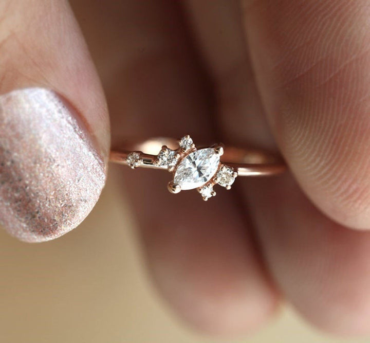 Lifestyle shot of marquise cluster diamond ring on hand