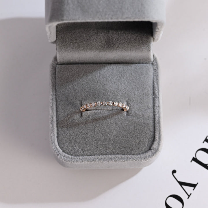 Round diamond wedding band in white gold