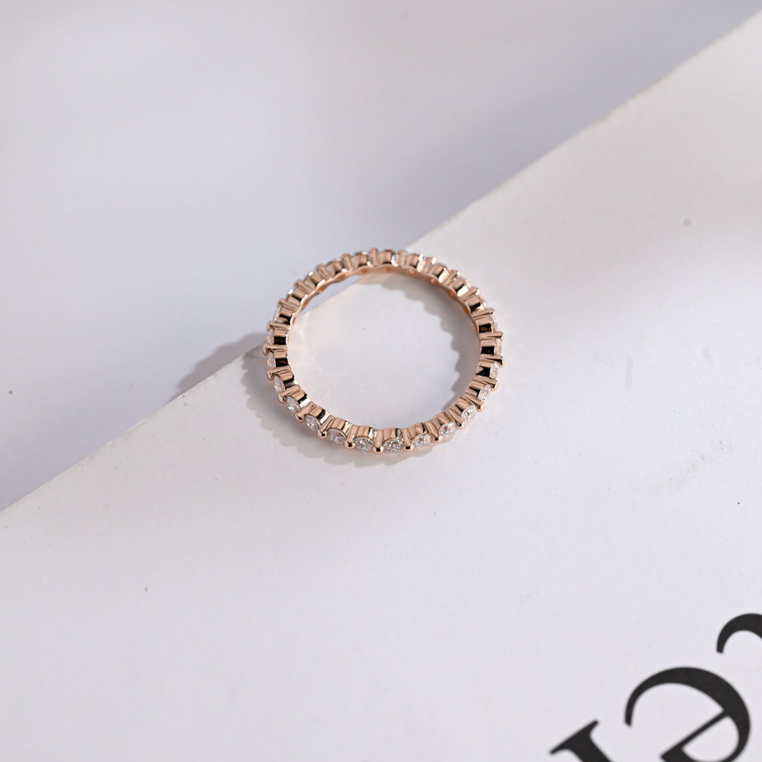 Round diamond band stacked with engagement ring