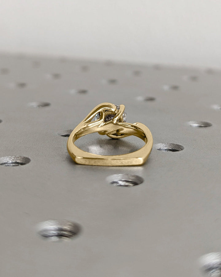 Round art deco engagement ring close-up highlighting diamond sparkle