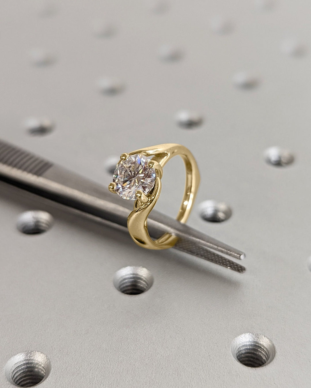 Close-up of round cut center diamond in art deco engagement ring