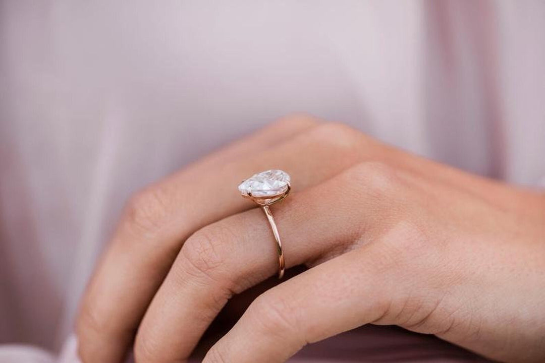 Detailed close-up of pear solitaire diamond engagement ring