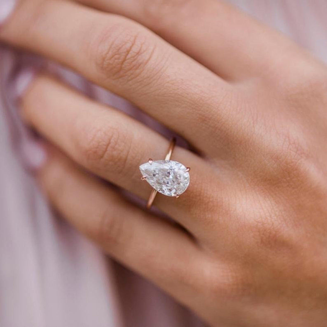 Pear solitaire lab grown diamond ring side profile in gold setting