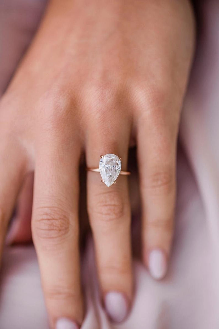 Pear cut engagement ring side view showing band detail