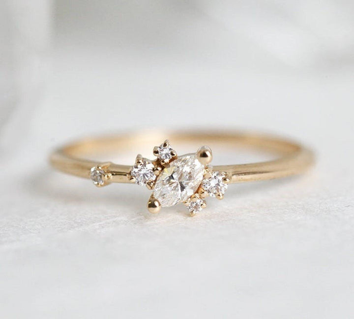 Marquise cut cluster engagement ring shown in real-life wear