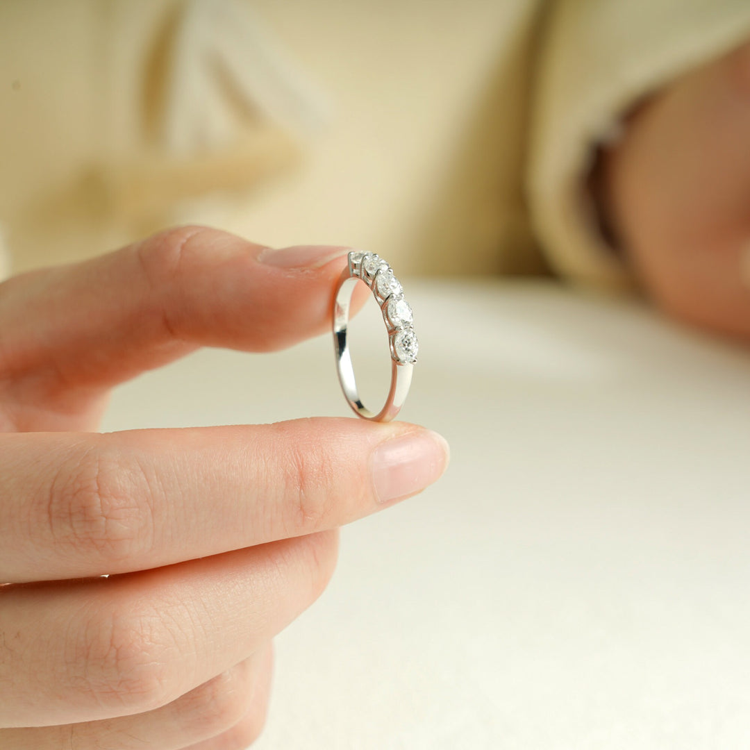 Oval diamond band stacked with engagement ring