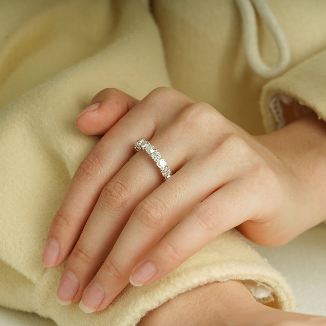 Cushion diamond band stacked with engagement ring