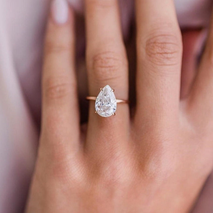 Side angle of pear solitaire diamond engagement ring