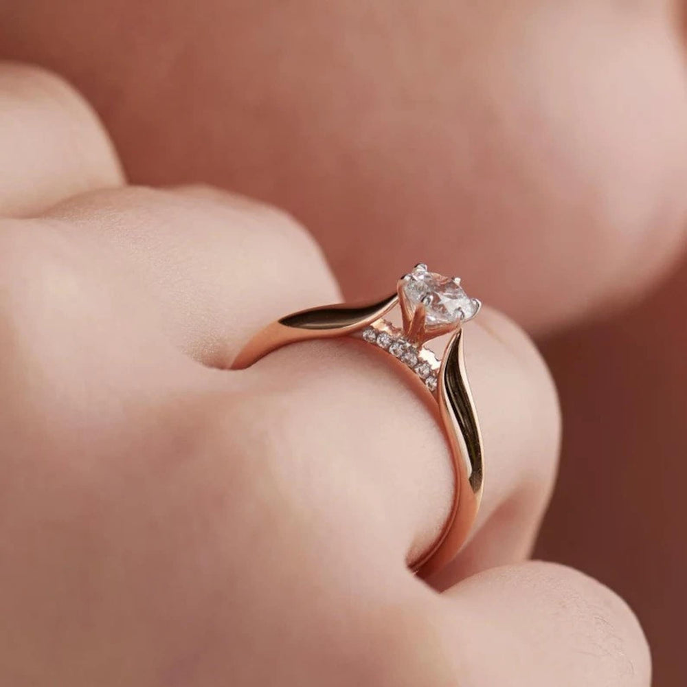 Round solitaire engagement ring viewed from the side