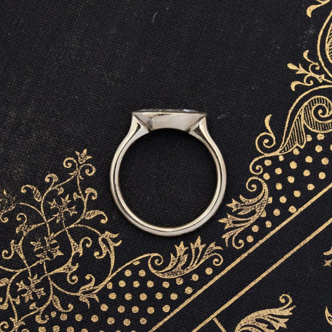 Diamond east west diamond ring displayed on jewelry stand