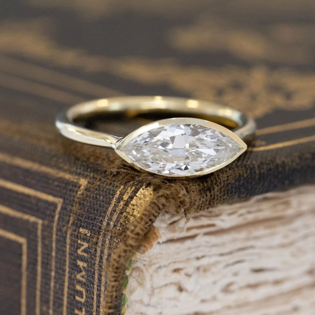 Angled view of diamond cut diamond in east west setting