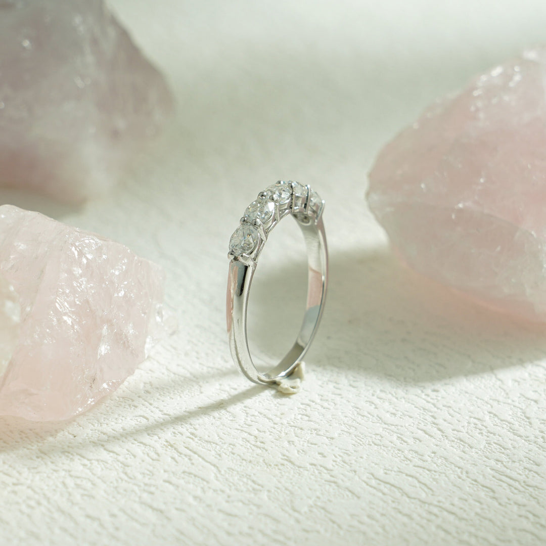 Side view of oval diamond wedding band