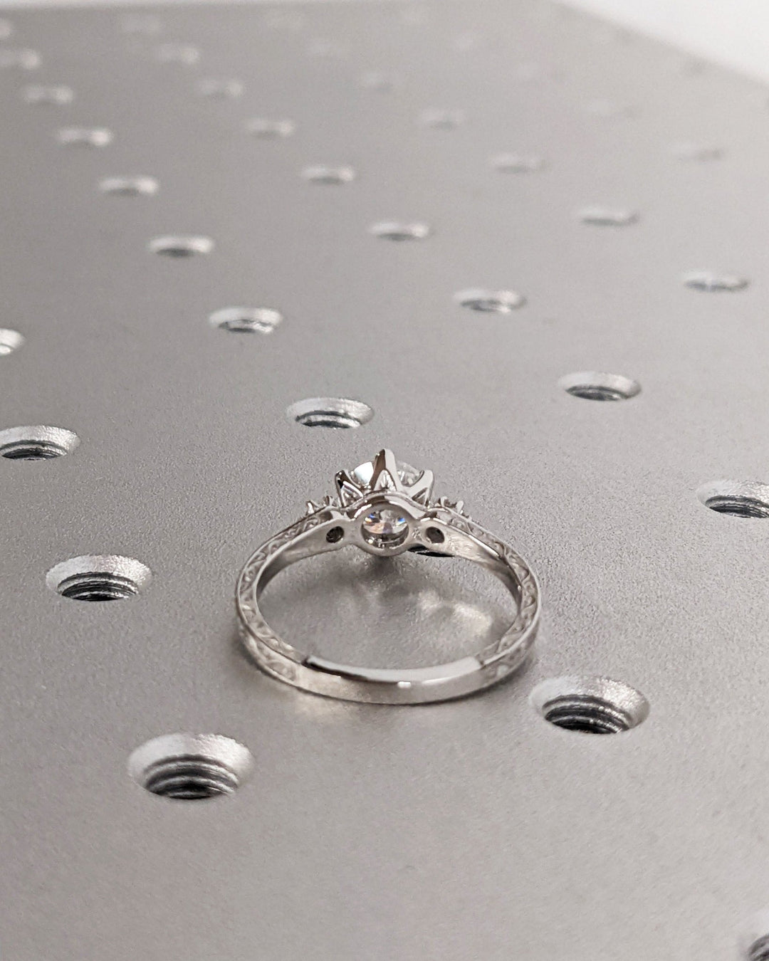 Round three stone lab grown diamond ring side profile in gold setting